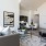 a living room with a couch and chairs