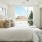 a bedroom with a large window