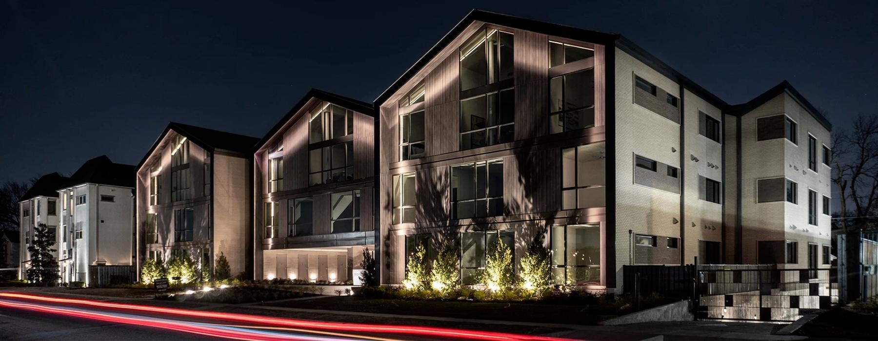 a building with a red streak of light in front of it