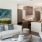 a living room with a large painting