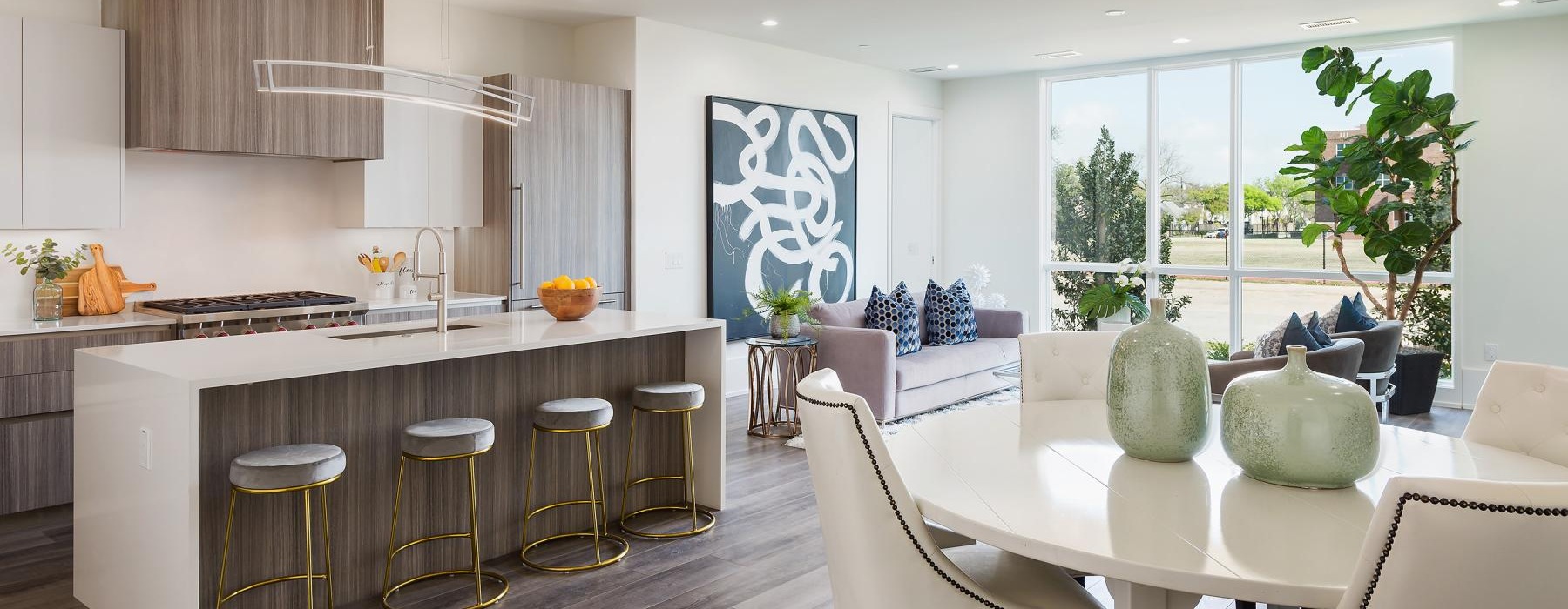 a kitchen with a bar and stools