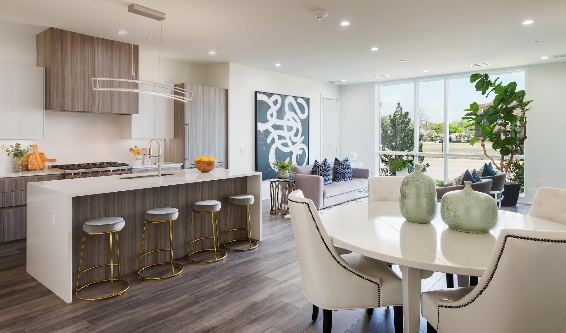 a kitchen with a bar and stools