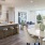 a kitchen with a bar and stools